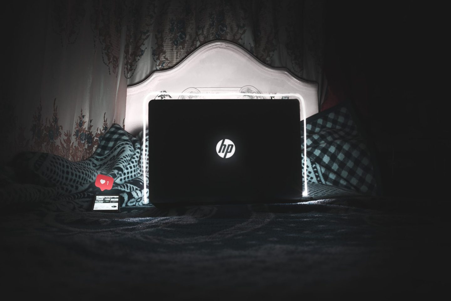 laptop in bed in the dark
